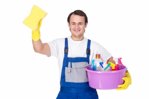 Commercial cleaner in Putney maintaining a tidy office workspace
