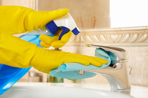Cleaner using protective gear while handling carpet cleaning products